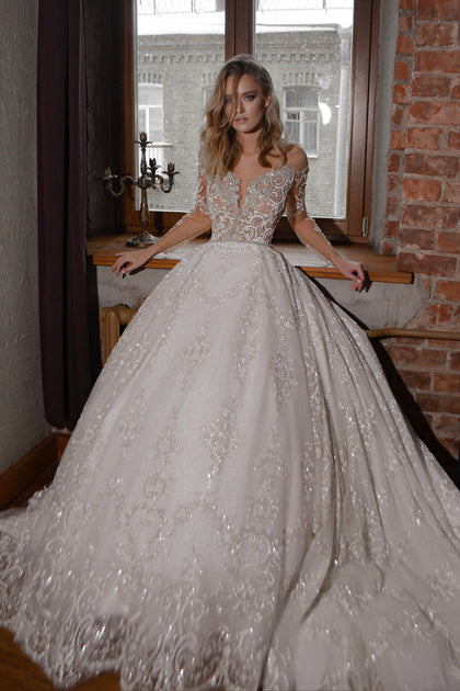 Romantic lace wedding dress with sheer sleeves, traditional bridal