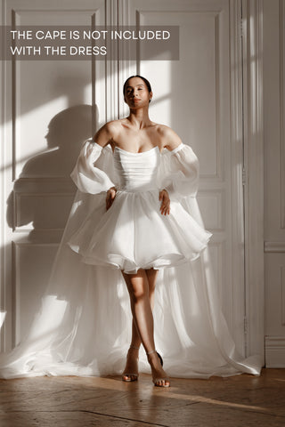 textured organza a line bridesmaid dress Luxurious minimalism meets modern romance An ivory A-line gown crafted in textured glitter organza. Complete with a draped corset, airy train, and detachable sleeves for the perfect touch of drama. #bridal #