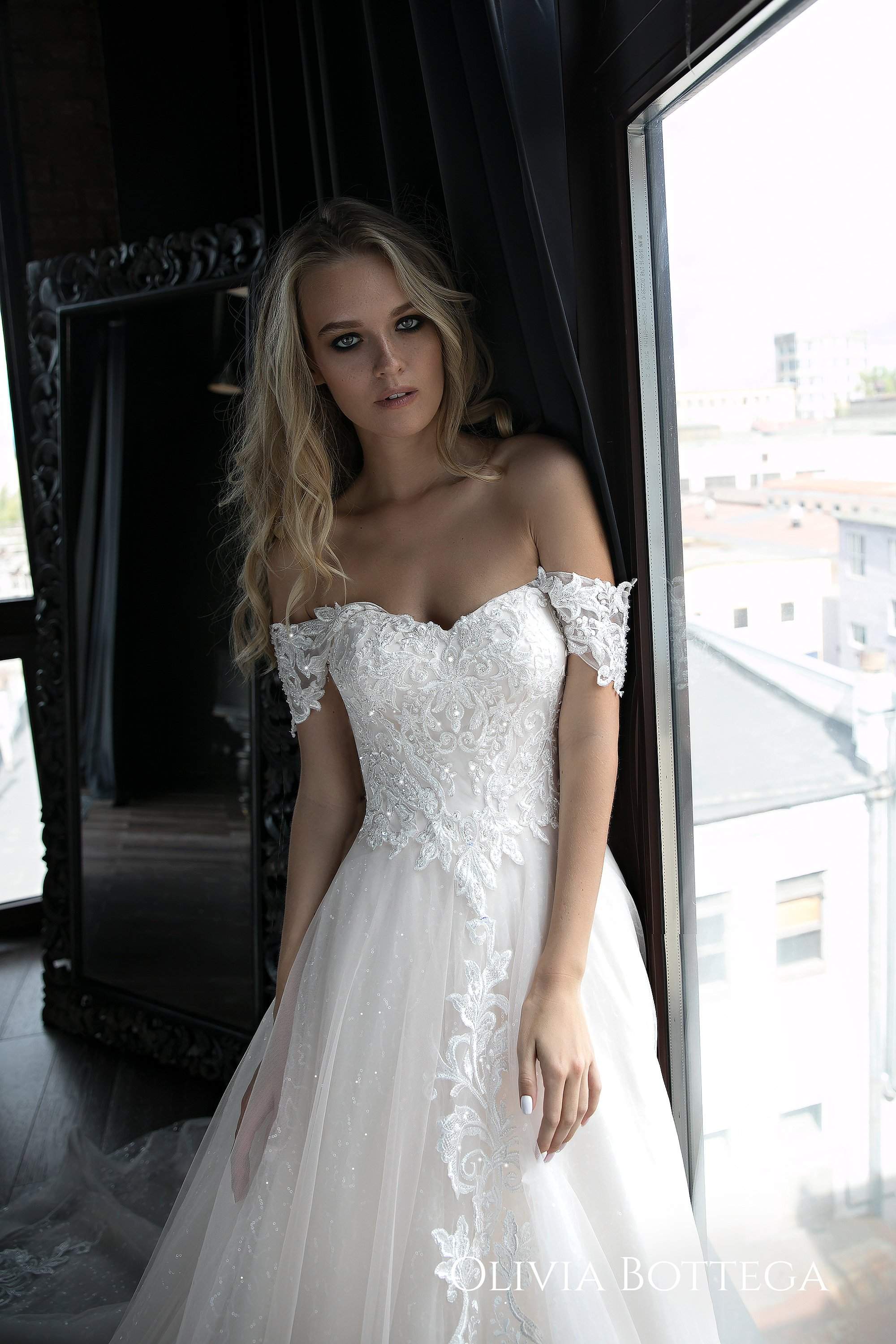 https://www.oliviabottega.com/cdn/shop/products/Ivia-by-Olivia-Bottega-Tulle-Wedding-Dress---A-Line-Wedding-Dress---A-Line-Dress---Tulle-Wedding-Dress---Tulle-Gown-oliviabottega-1609190549.jpg?v=1659611375